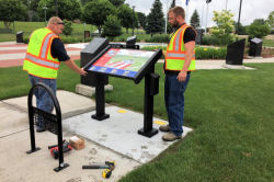 The new sign for VETERANS PARK has arrived and was installed today, July 1st, 2019, by the City Parks and Recreation crew. This new sign is interactive and describes VETERANS PARK features, history, a paver e-Locator, order form holster and a events section. Go there and check it out!